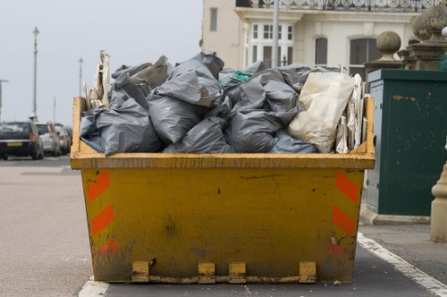 Company van and crew preparing for commercial waste collection